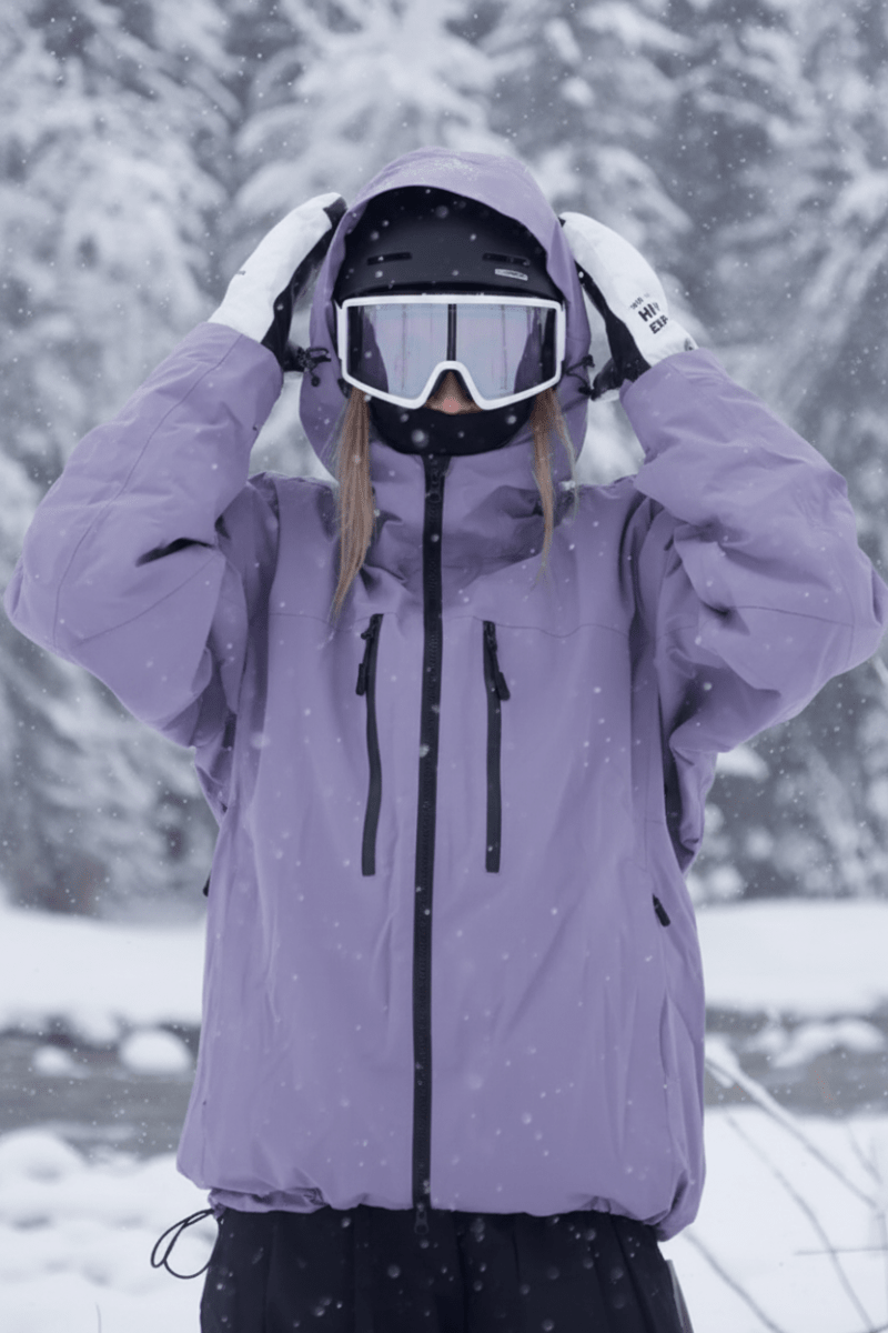 Detail of waterproof fabric on a gray unisex ski jacket. Essential cold weather activewear for snow sports.