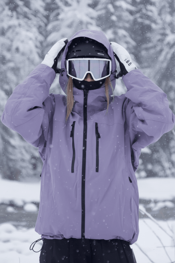Detail of waterproof fabric on a gray unisex ski jacket. Essential cold weather activewear for snow sports.