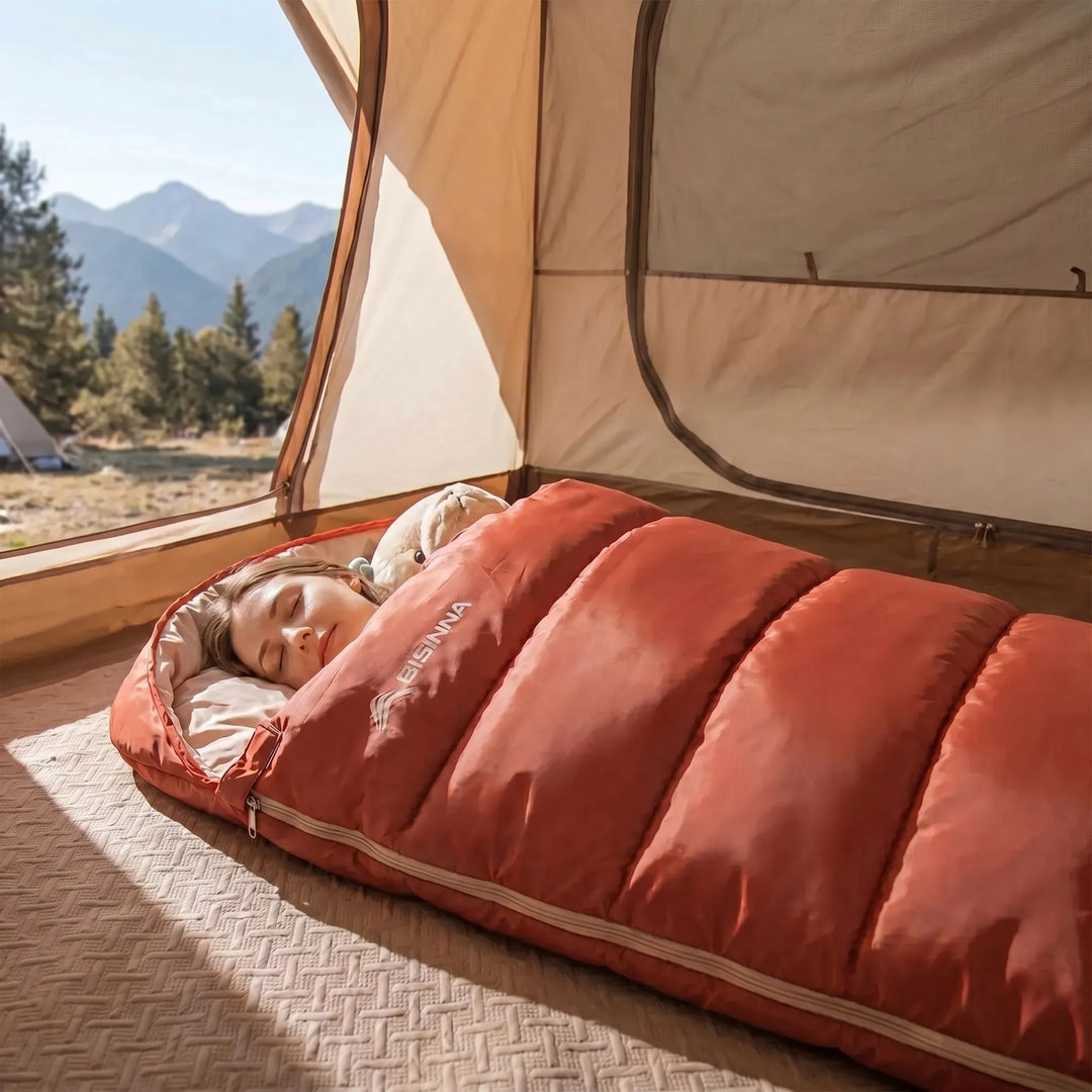 Unisex wide 3-season camping sleeping bag for adults, offering spacious comfort for outdoor hiking & backpacking.