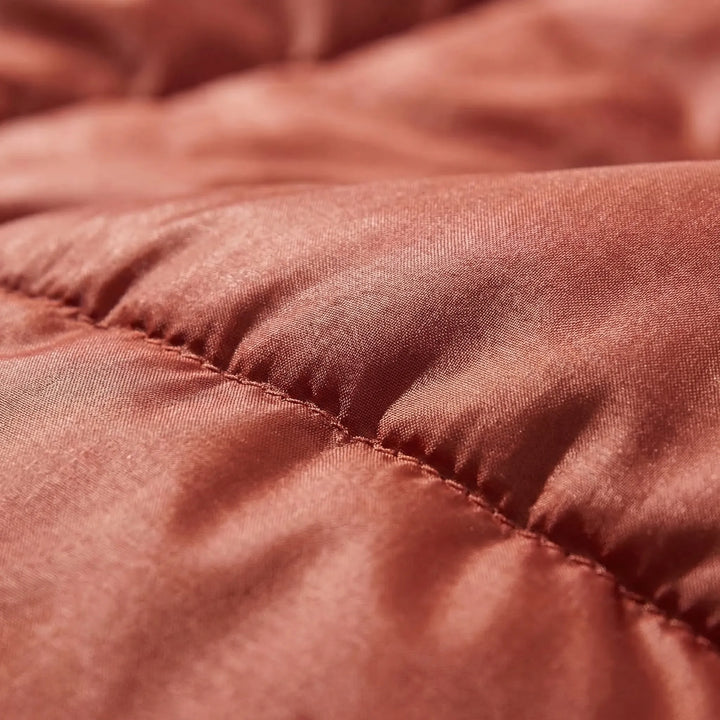 Packed 3-season wide sleeping bag for adults, lightweight and portable for easy backpacking and camping trips.