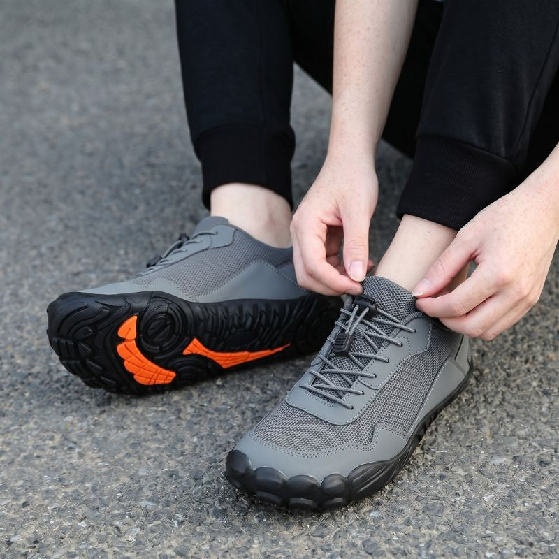 Lightweight breathable unisex hiking shoes, wide toe box, orthopedic support for natural trail walking.