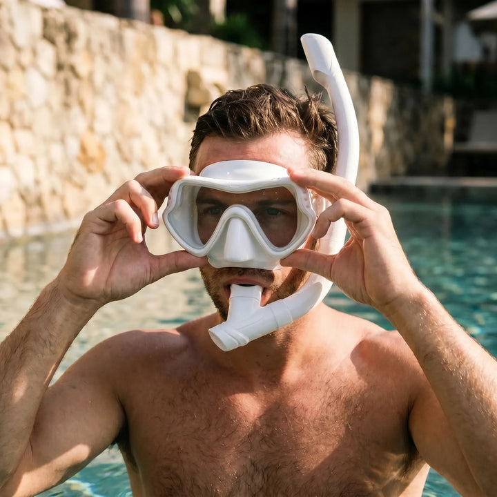 Unisex wide view snorkeling mask with crystal clear tempered glass for underwater exploration.