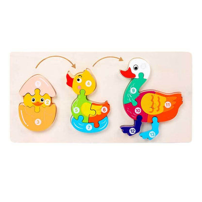 Happy child assembling a wooden animal growth animal puzzle, fun educational toy