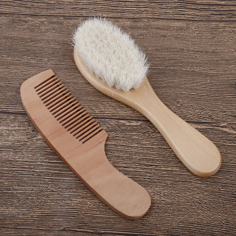 Infant grooming set featuring a smooth wooden comb and soft brush
