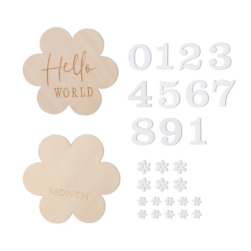 Baby hands holding a 'six months' wooden milestone card, capturing baby's development