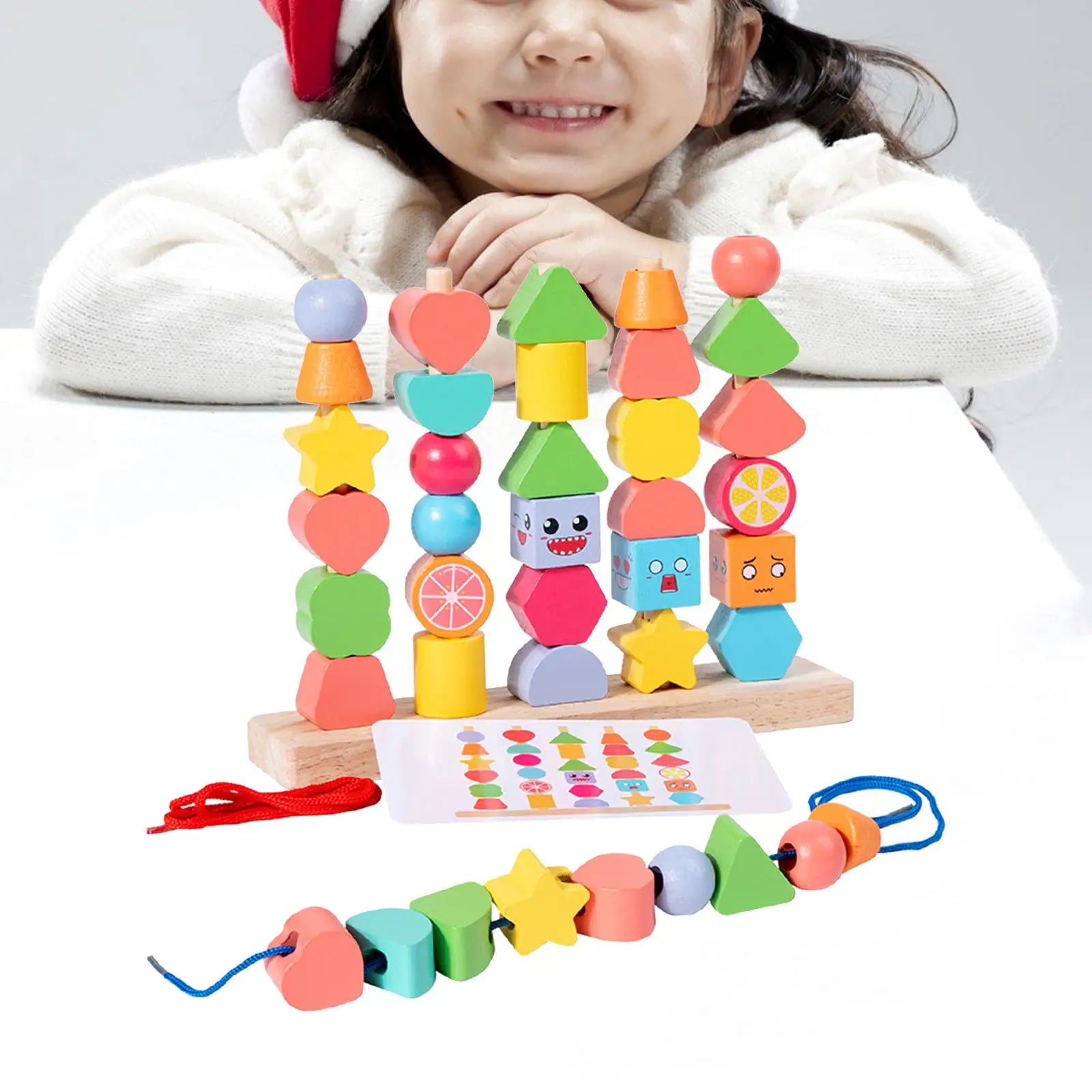 Toddler playing with unisex wooden learning blocks, stacking and stringing beads for early development.