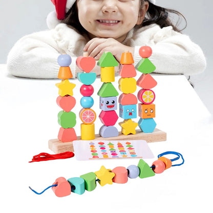 Toddler playing with unisex wooden learning blocks, stacking and stringing beads for early development.