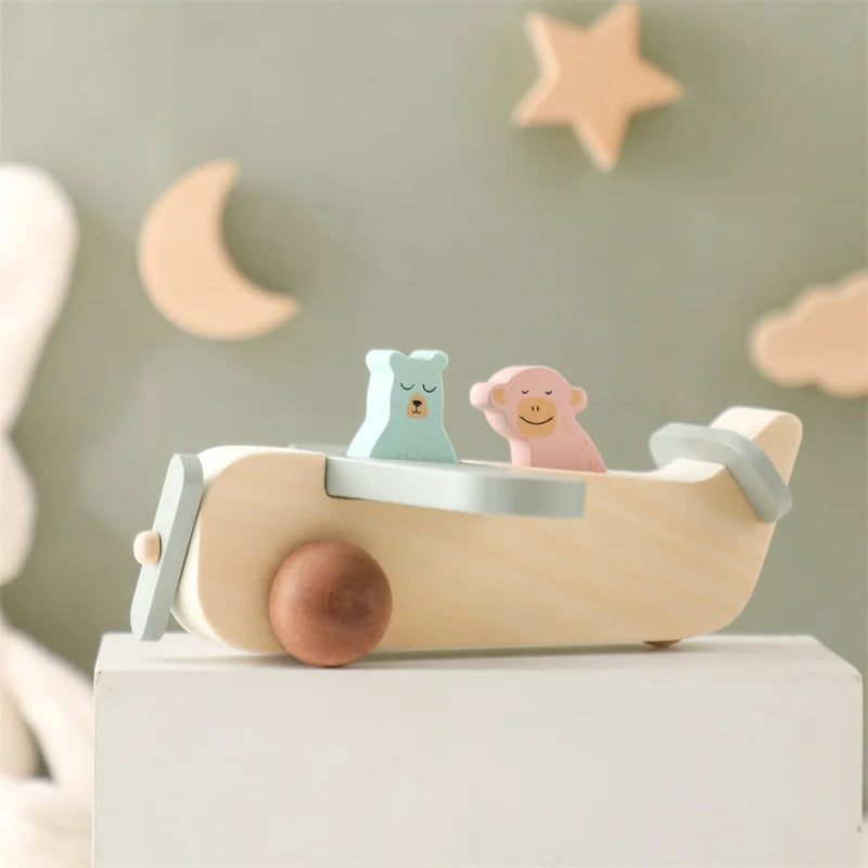 Toddler playing with wooden Montessori airplane toy, promoting creative and educational play