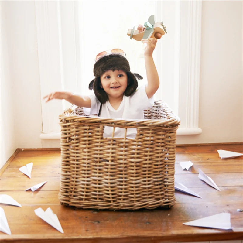 Wooden airplane toy on a playmat, a Montessori-inspired educational toy for young kids