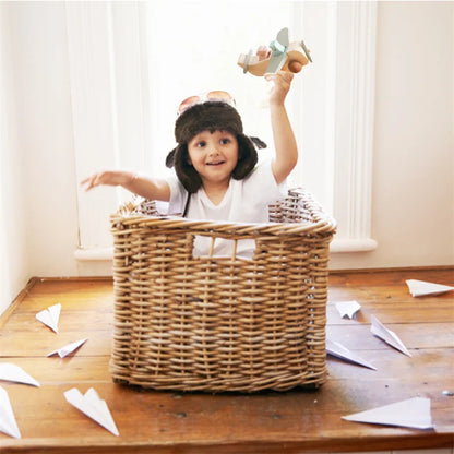 Wooden airplane toy on a playmat, a Montessori-inspired educational toy for young kids