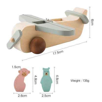 Smiling child interacting with a durable wooden Montessori airplane, great for baby activity