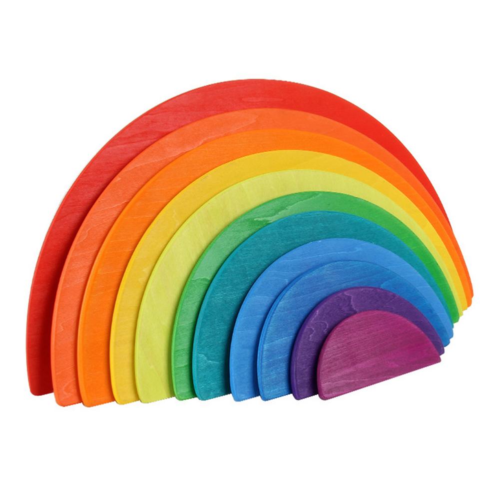 Close-up of smooth wooden rainbow stacker discs, perfect educational toy for toddlers and kids.