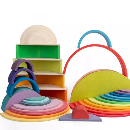 Vibrantly painted wooden rainbow stacker discs arranged in an arch, an engaging educational toy.