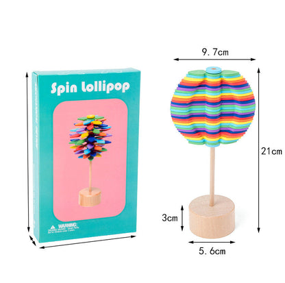 Hand holding a wooden rotating fidget toy, portable stress relief for all ages