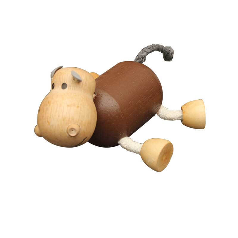 Toddler arranging wooden farm animals, focused play with developmental preschool toys