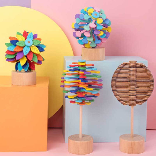 Unisex wooden spinning stress relief lollipop toy on white background; perfect fidget desk gadget.