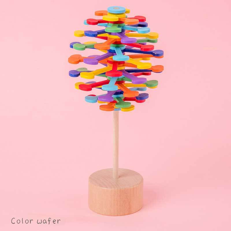 Wooden spinning lollipop toy displayed as a desk decor item, offering visual appeal and stress relief.
