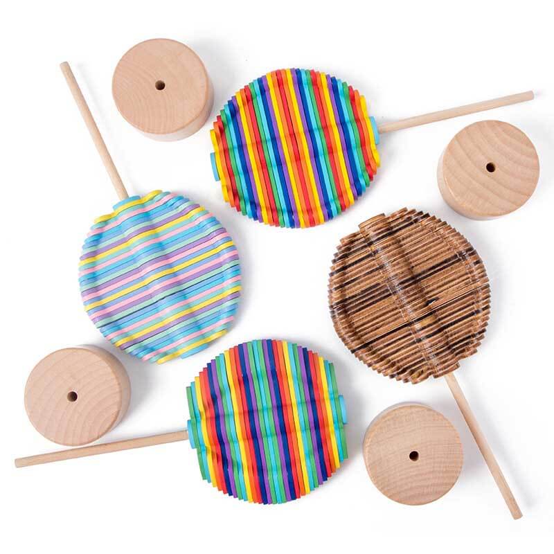 Top-down view of a spinning wooden lollipop toy, highlighting its intricate design and smooth rotation for stress relief.