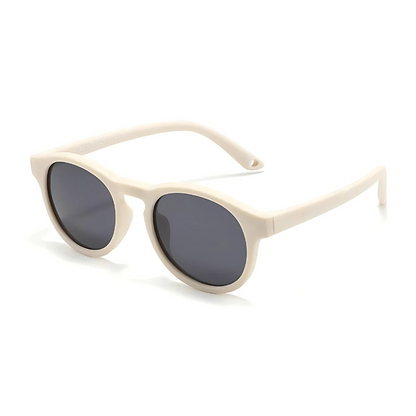 Kids' outdoor gear: flexible, polarized, UV400 sunglasses for boys and girls, ensuring eye safety.