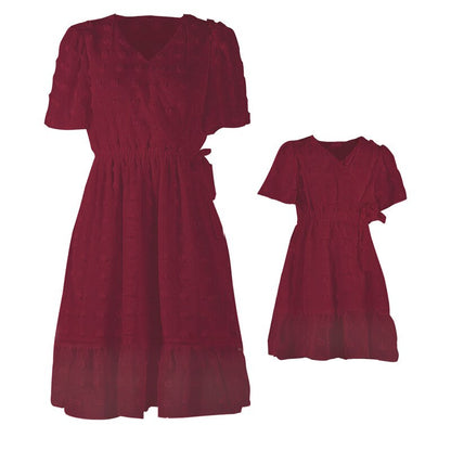 Stylish V-neck short sleeve mother daughter dresses in soft polyester, perfect for warm weather