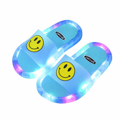 Close-up of a pink light-up non-slip summer slipper for kids, soft PVC material