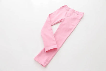 Girls' everyday wear: stylish candy-colored ankle-length pencil pants with an elastic waist.