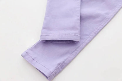 Playful candy-colored girls' pencil pants with elastic waist, perfect for vibrant child clothing.