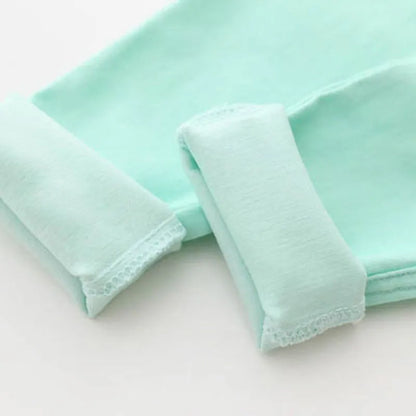 Bright candy-colored girls' pencil pants, an essential for a playful and stylish spring outfit.