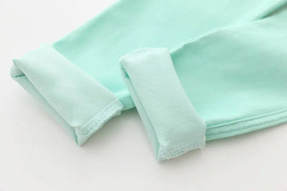 Colorful candy-colored pencil pants for girls, designed with a comfortable elastic waist for kids' fashion.
