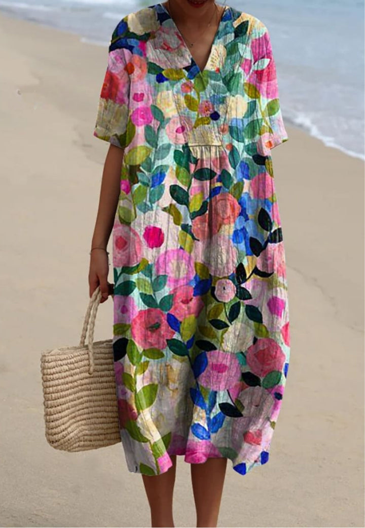 Vibrant floral garden print flowy dress for women, perfect for spring/summer casual or party wear. Relaxed A-line fit.