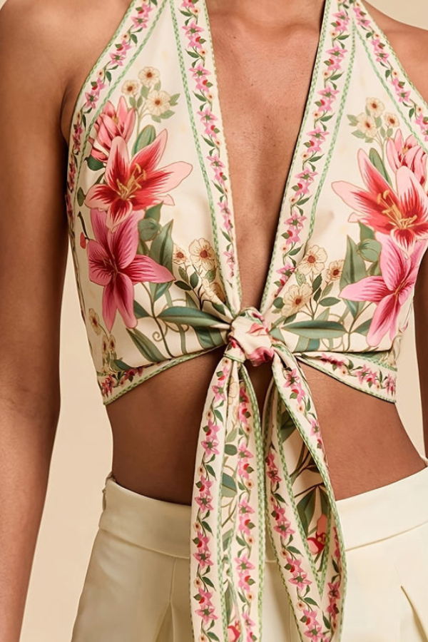 Elegant women's halter top featuring a beautiful and vibrant floral print. Perfect for summer.
