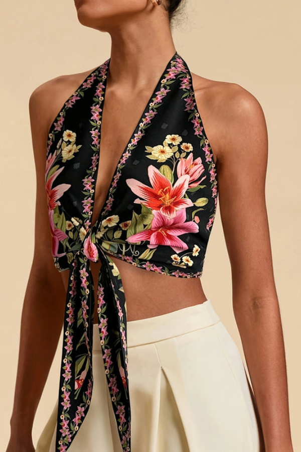 Back view of a women's vibrant floral halter top, showing the tie-back detail. Beach vacation wear.