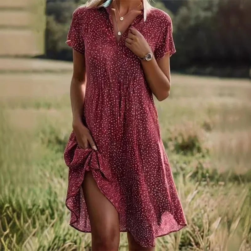 Chic women's short floral midi dress, vibrant design, comfortable & flowy, suitable for casual wear or parties.