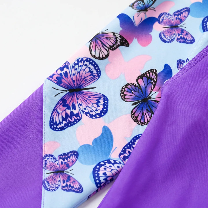 Active girls' long-sleeve rash guard for pool or beach. Vibrant swim top ensures kids' sun protection.