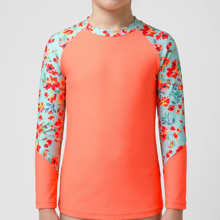 Vibrant girls' long-sleeve rash guard, essential kids' swimwear for superior sun protection.