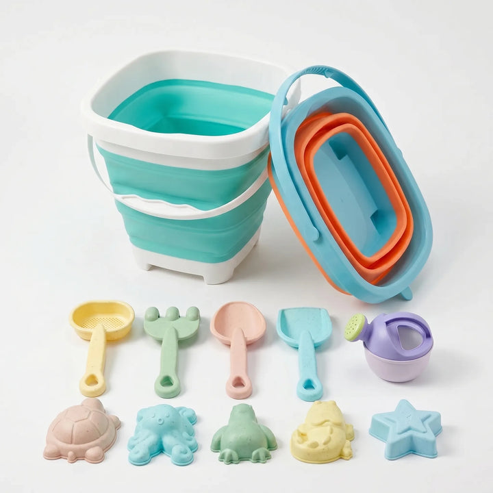Travel-friendly kids' beach toy set with collapsible bucket & sand tools for creative sand play & summer fun.