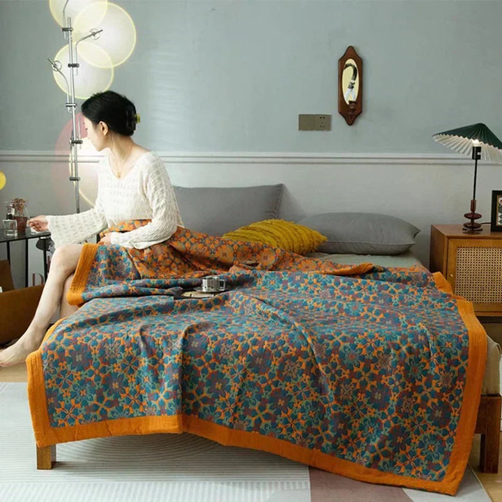 Vibrant orange & blue six-layer cotton quilt. Comfortable & warm unisex bedding for stylish bedroom decor.