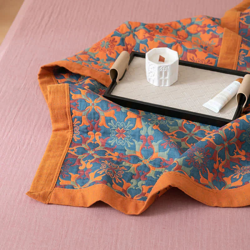 Cozy six-layer cotton quilt in vibrant orange & blue. Plush, warm unisex bedding perfect for a comfortable night's sleep.