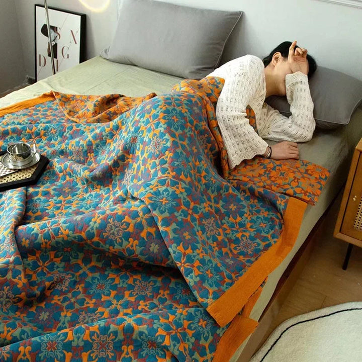 Striking orange & blue pattern on a soft, six-layer cotton quilt. Eco-friendly unisex duvet for any bedroom.
