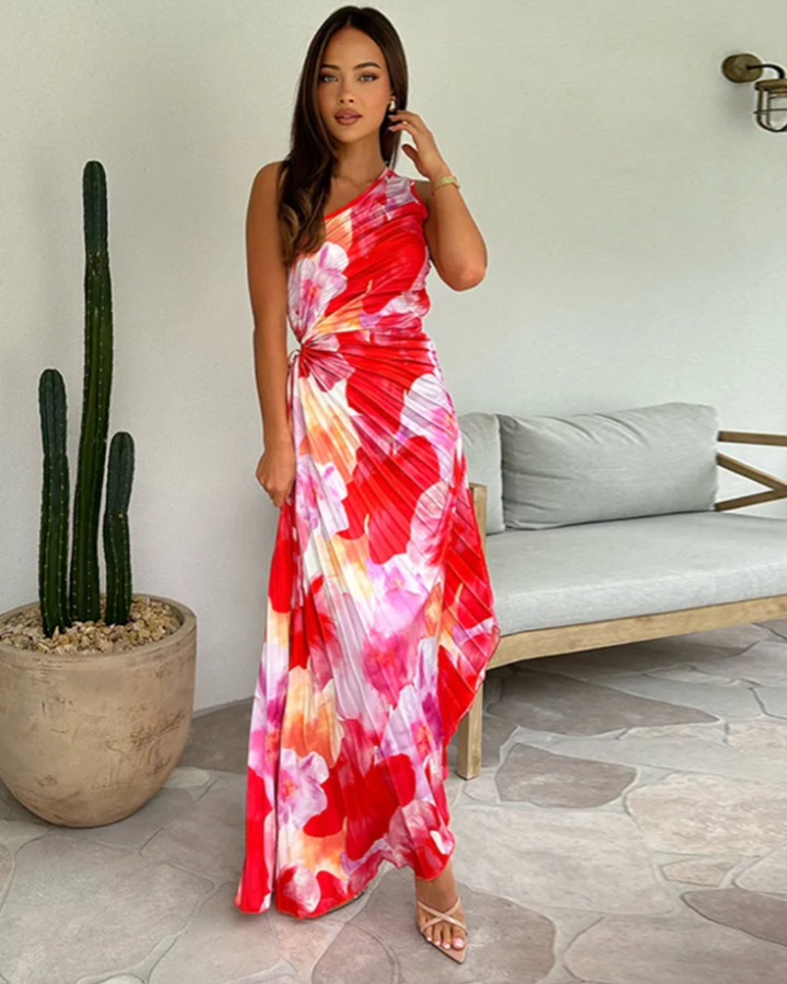 Vibrant printed one-shoulder gown with asymmetric hem, perfect as a wedding guest or formal party dress.