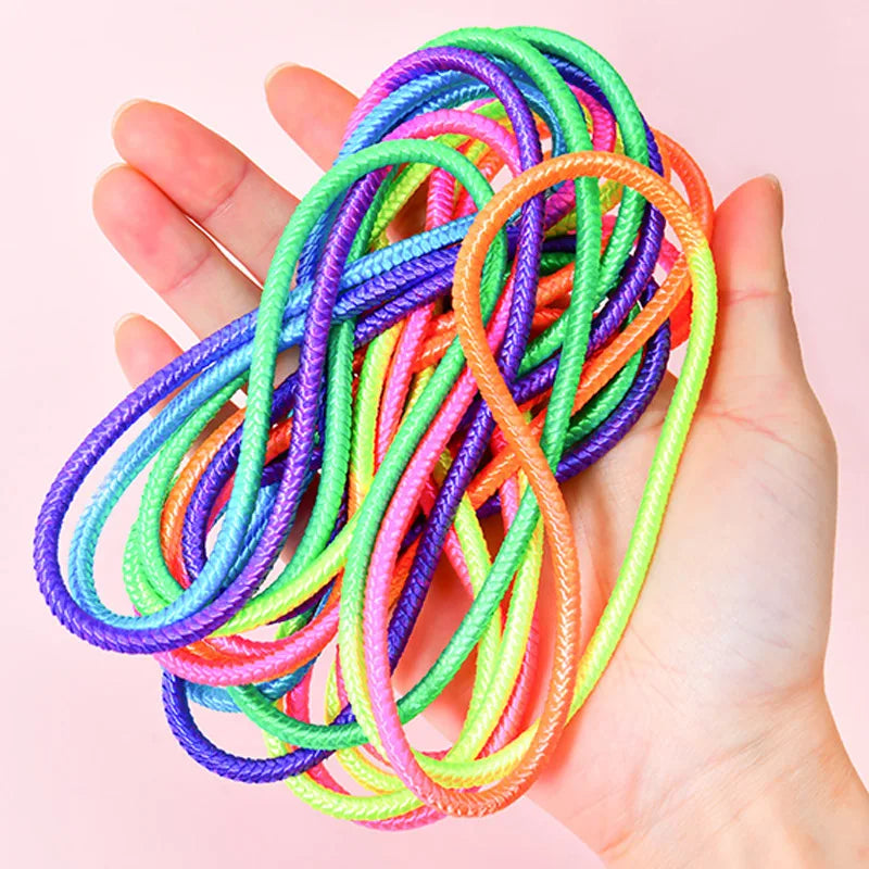 Ergonomic handle of a kids' rainbow jump rope, providing a secure grip for playful exercise