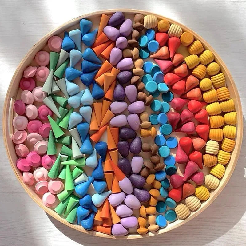 Vibrant wooden rainbow stacking blocks set for creative play, developing fine motor skills in kids