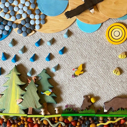 Arrangement of smooth wooden rainbow blocks demonstrating diverse stacking possibilities for kids