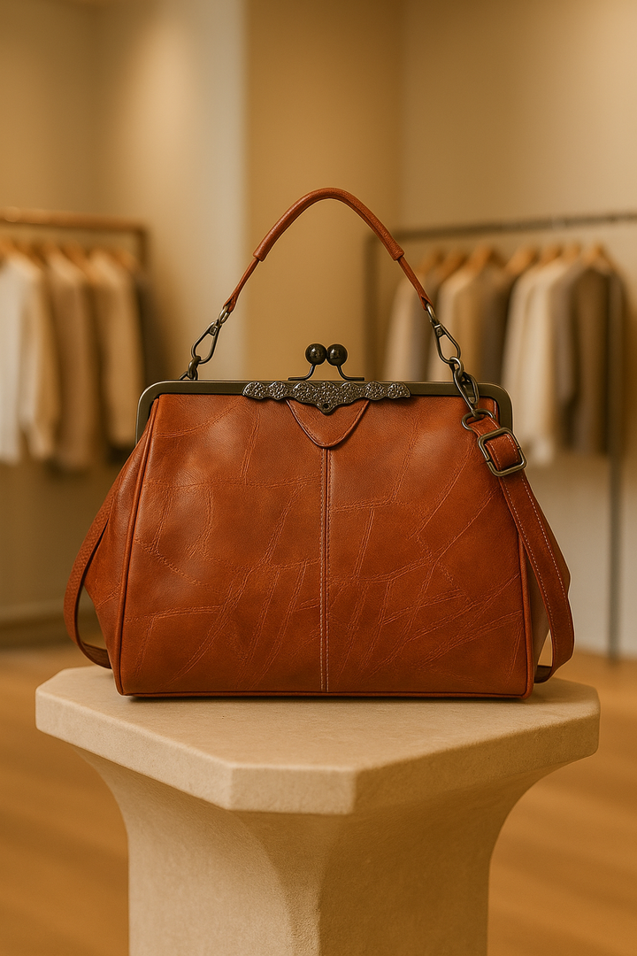 Vintage brown leather shoulder bag for women, classic elegant style.