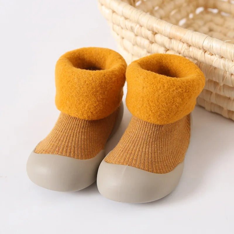 Soft cotton unisex baby socks with anti-slip soles, designed for warmth and safety