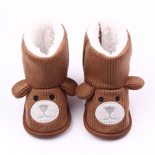 Overhead shot of soft sole baby winter boots, anti-slip design, perfect for home or nursery