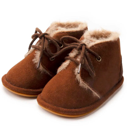 Chic infant crib shoes, combining baby fashion with essential winter warmth and non-slip features.