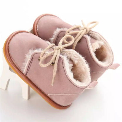 Stylish infant winter crib shoes, a must-have for keeping baby's feet toasty.