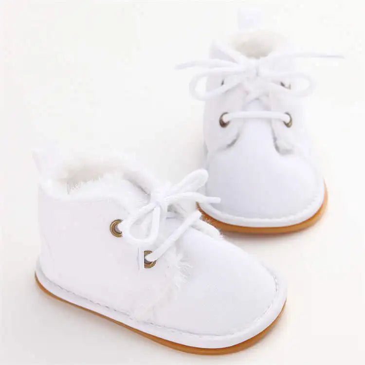 Comfortable baby crib shoes, offering warmth and a non-slip design for young toddlers.