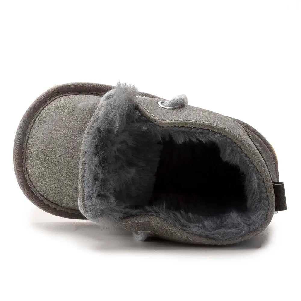 Durable baby footwear: warm crib shoes with non-slip sole for safe toddler play.